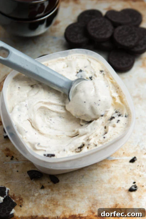 The creamiest and best homemade ice cream I have ever, ever made. Cookies and Cream Frozen Custard on ohsweetbasil.com A close-up shot of the incredibly rich and smooth texture of homemade Cookies and Cream Frozen Custard, bursting with chocolate sandwich cookie pieces. A top-rated recipe from ohsweetbasil.com.