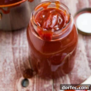 A charming image of a freshly made homemade BBQ sauce in a mason jar, ready to be served or stored.