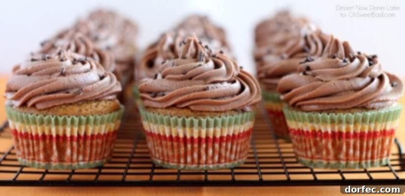 Close-up of a frosted Pumpkin Cupcake ready to be enjoyed