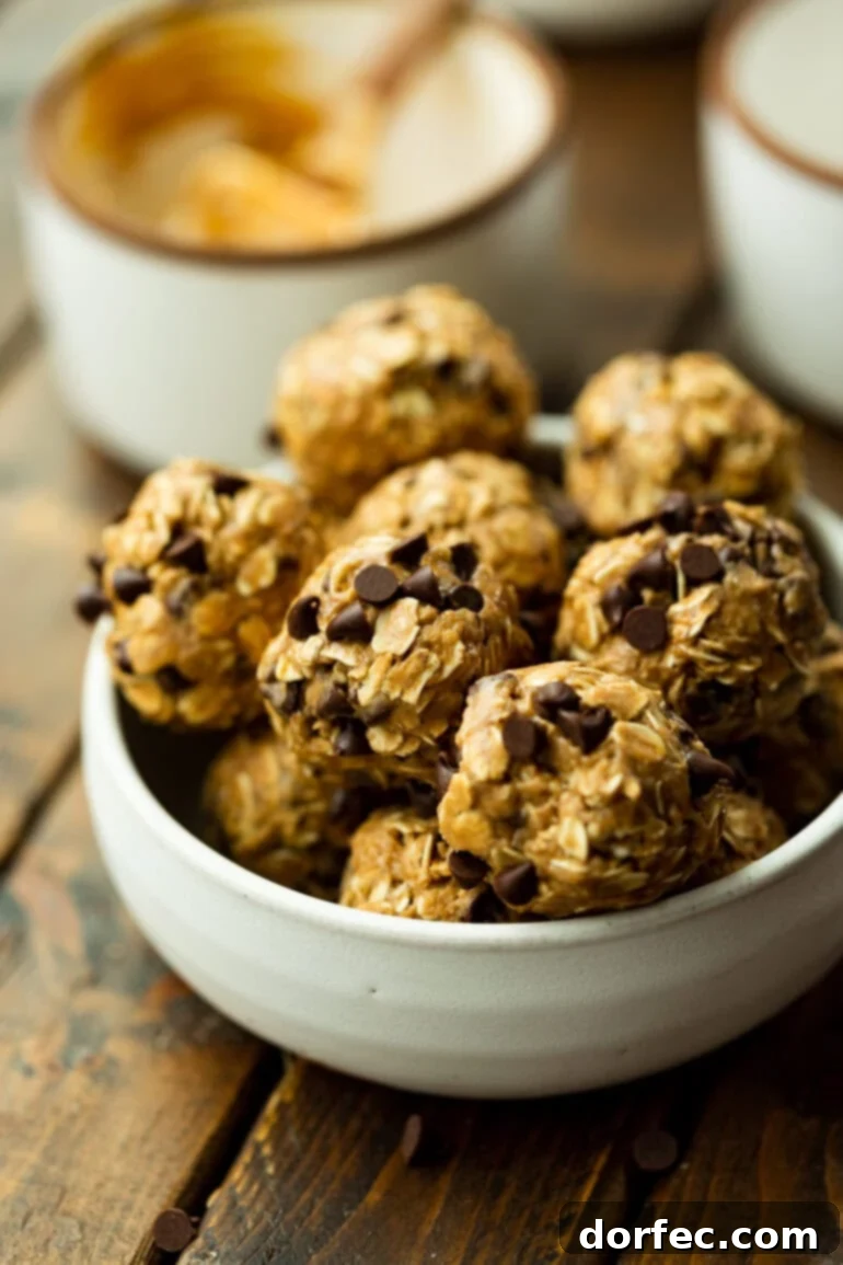 A vibrant photo of a bowl brimming with homemade peanut butter chocolate chip oatmeal energy bites, perfectly round and ready for a healthy snack.