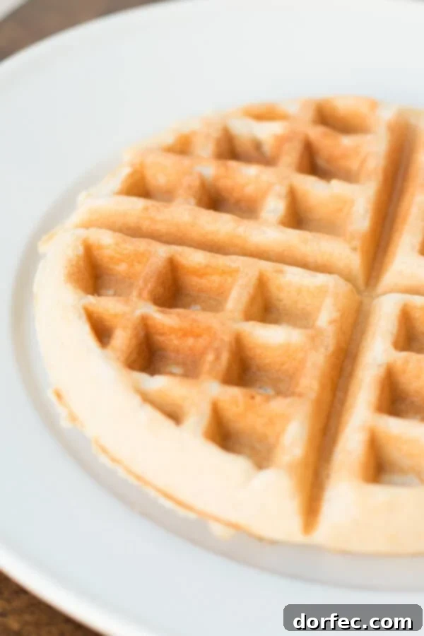 The secret to making your store-bought waffle mix taste like homemade: Coconut Oil Waffles. Perfect for a delicious breakfast.