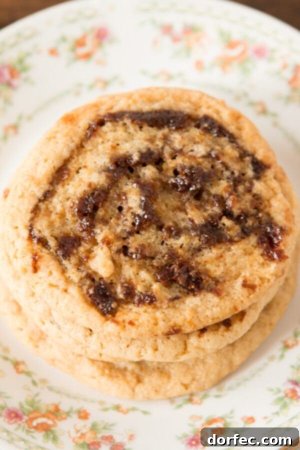 stack of three Pinwheel Cookies on floral plate
