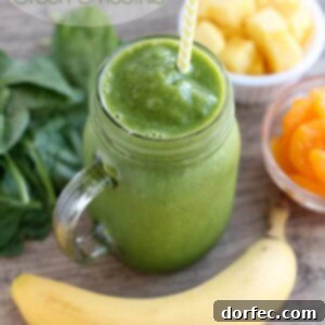 Close-up of Pineapple Orange Banana Green Smoothie