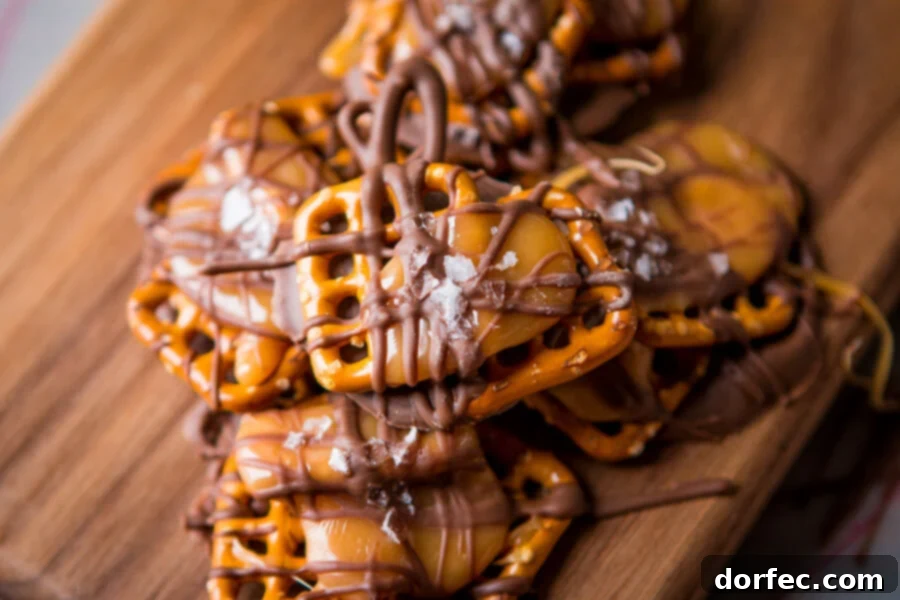 An overhead shot of a finished platter of salted caramel pretzel snaps, ready for serving or gifting, showcasing their golden and chocolate hues.