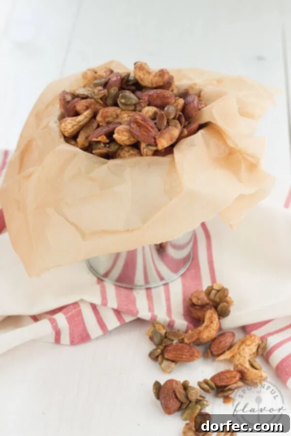 Close-up shot of Spiced Trail Mix showing the texture of seasoned nuts, coconut, and pepitas.