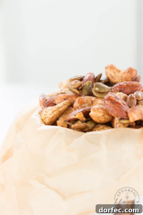 Close-up of Spiced Trail Mix on a baking sheet, freshly roasted and ready to cool.
