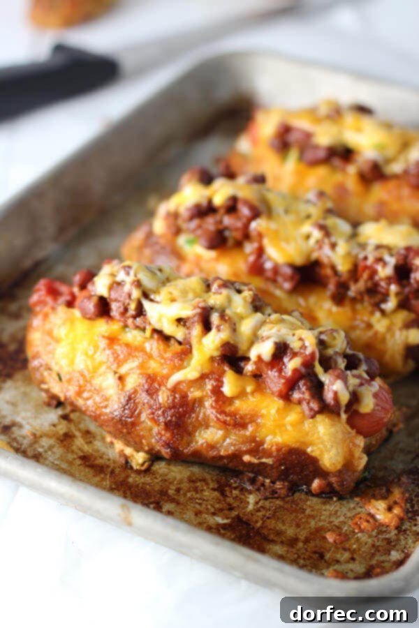 Spicy Jalapeno Cheddar Pretzel Hot Dogs with Chili Cheese Jalapeno and Cheddar Pretzel Hot Dog Buns served with Turkey Chili Cheese