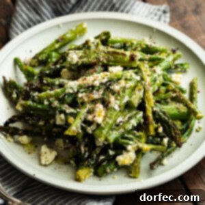 Zesty 5-Minute Lemon Feta Grilled Asparagus 10 A close-up photo of broiled or grilled asparagus, perfectly cooked and ready to be served. Ideal for quick and healthy meals.