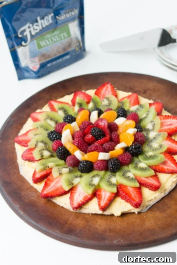 Another enticing view of Mom's fruit pizza, highlighting its fresh ingredients and homemade appeal.