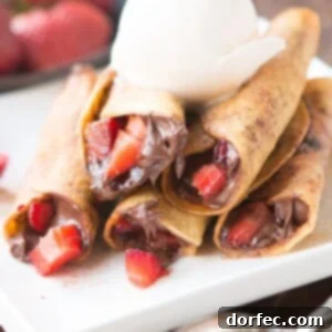 Nutella Strawberry Taquitos deep fried and rolled in cinnamon sugar