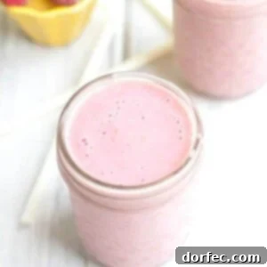 Vibrant Raspberry Pineapple Coconut Smoothie in a glass