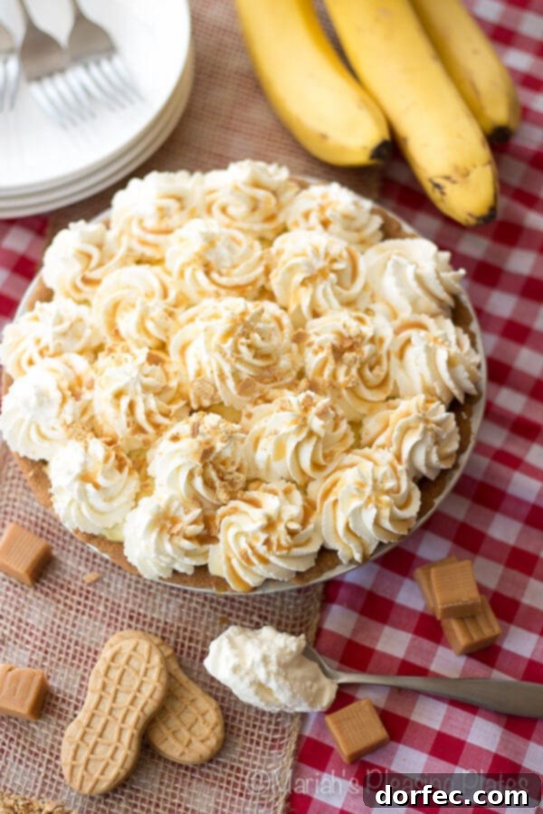 Close-up view of Salted Caramel Banana Pie slice with caramel dripping.