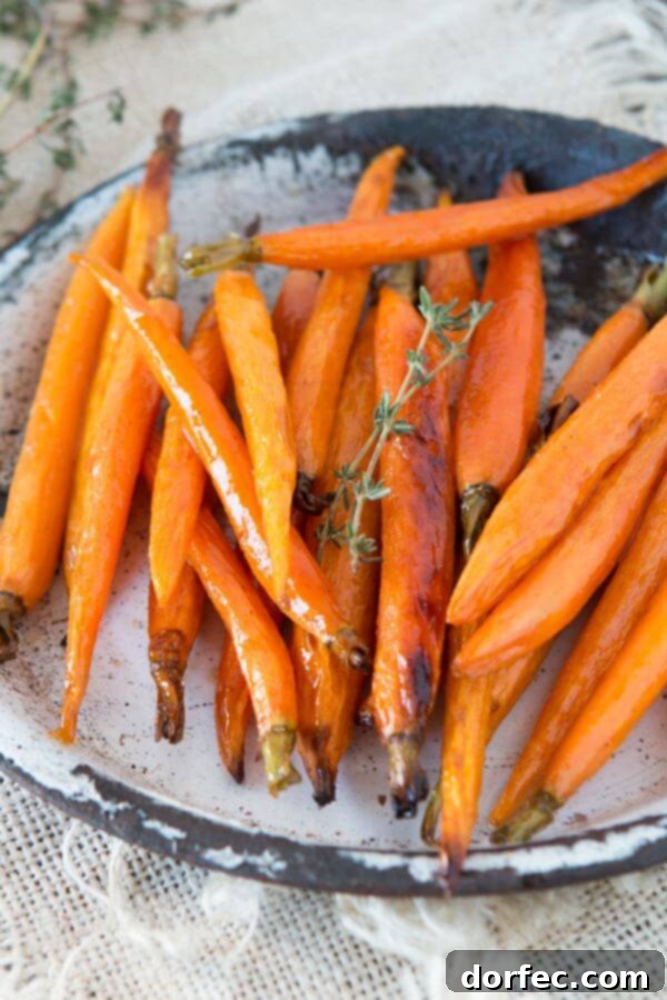 The ultimate family favorite: honey roasted carrots, perfect for any occasion. Full recipe details on ohsweetbasil.com.