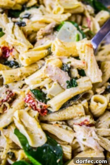 Pesto Chicken Pasta with Sun-Dried Tomatoes and Artichokes Preparing the Rich Pesto Cream Sauce