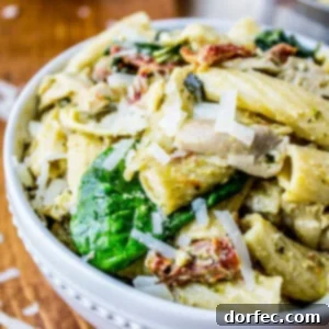 Vibrant Pesto Chicken Pasta with Sun-Dried Tomatoes and Artichokes 2 Pesto Chicken Pasta with Sun-Dried Tomatoes and Artichokes