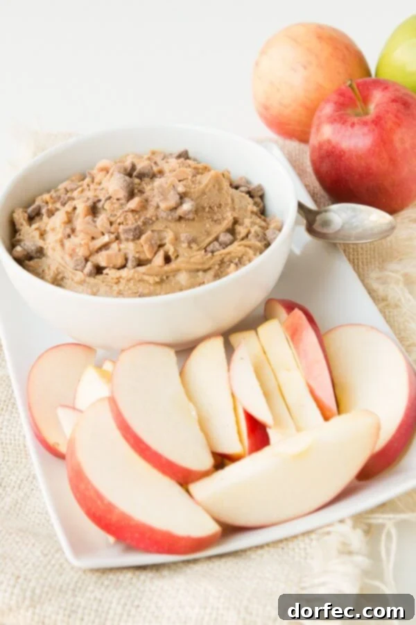 Peanut Butter Toffee Apple Dip garnished with extra toffee bits, ready for serving