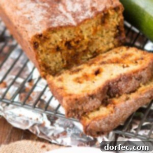 Snickerdoodle Zucchini Bread recipe card image, featuring a golden brown loaf
