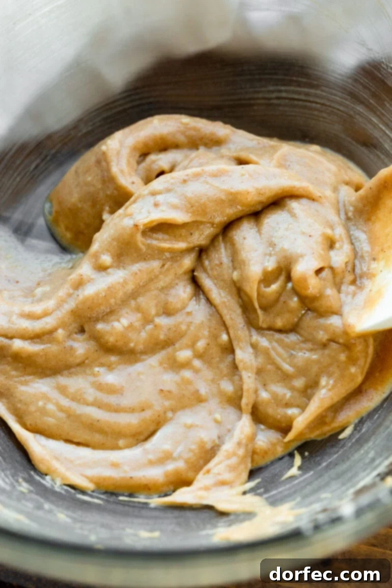 A bowl of spiced apple slices ready for the crisp topping.