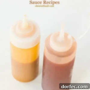 Two jars of Carolina BBQ sauce, one mustard-based and one vinegar-based, showcasing their vibrant colors and smooth textures.