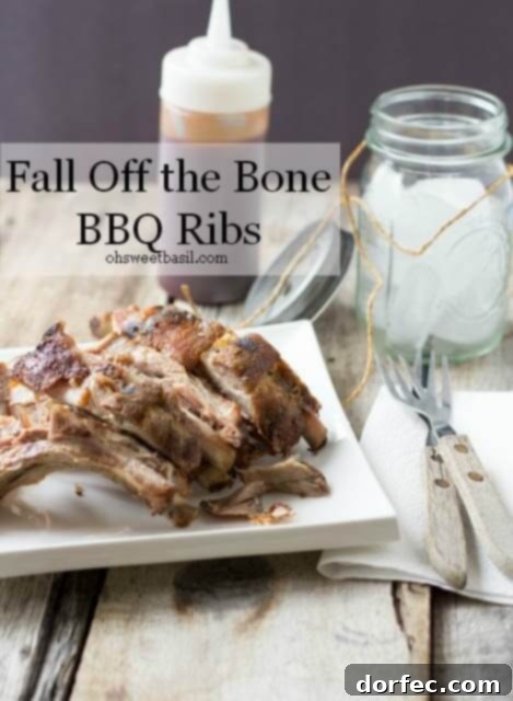 Perfectly cooked, fall-off-the-bone BBQ ribs, glistening with sauce and ready to be enjoyed.