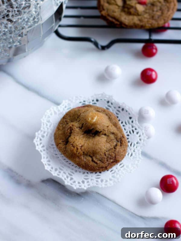 Soft-Baked Molasses Delights 10 Crunchy white chocolate peppermint gingersnaps with festive M&M's, a vibrant and flavorful holiday cookie.