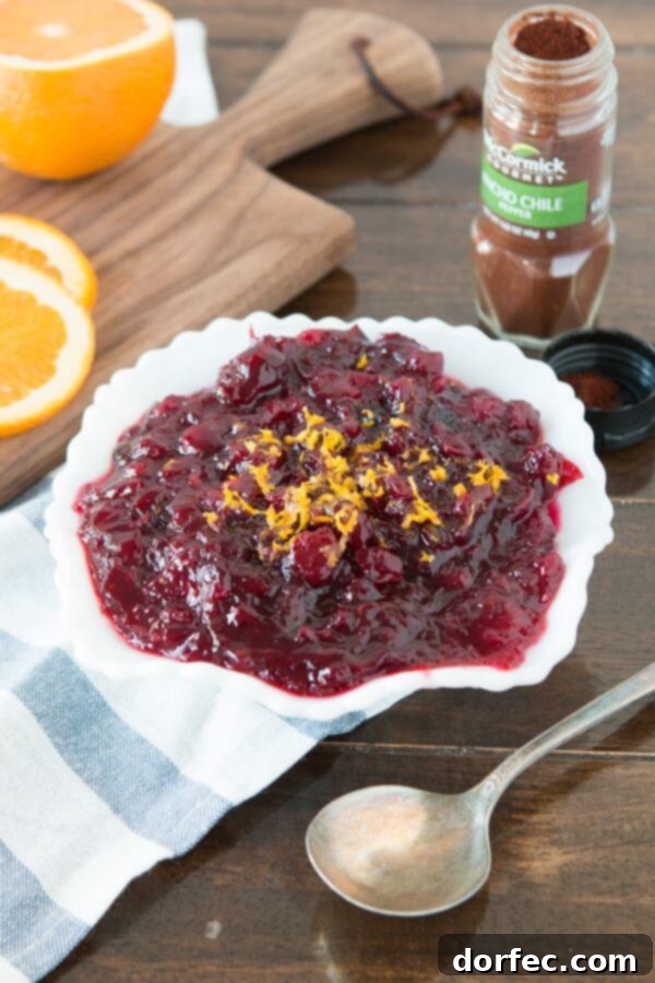 Our favorite cranberry sauce with a hint of orange and a secret ingredient that you will love! ohsweetbasil.com Better than Grandma's Spiced Orange Blackberry Cranberry Sauce