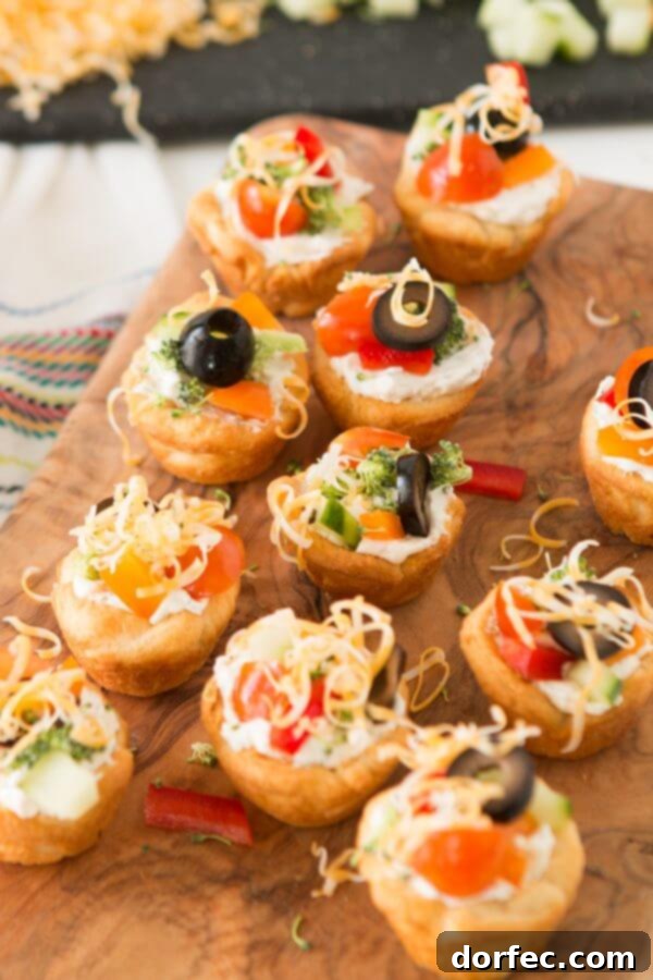 Quick and easy veggie pizza tarts with the best filling I've had for this easy appetizer ohsweetbasil.com Quick and easy veggie pizza tarts with the best filling I've had for this easy appetizer ohsweetbasil.com