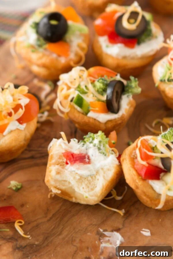 Quick and easy veggie pizza tarts with the best filling I've had for this easy appetizer ohsweetbasil.com Quick and easy veggie pizza tarts with the best filling I've had for this easy appetizer ohsweetbasil.com