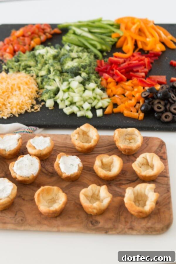 Quick and easy veggie pizza tarts with the best filling I've had for this easy appetizer ohsweetbasil.com Quick and easy veggie pizza tarts with the best filling I've had for this easy appetizer ohsweetbasil.com