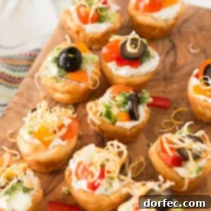 Quick Mini Veggie Pizzas 2 Quick and easy veggie pizza tarts with the best filling I've had for this easy appetizer ohsweetbasil.com