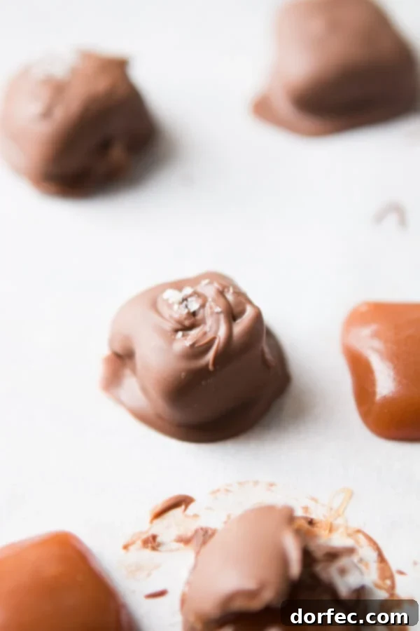Achieving Soft and Chewy Caramel Perfection A batch of freshly made soft and chewy homemade caramels, ready to be dipped in chocolate and salted.