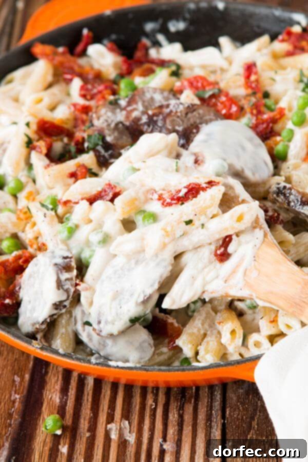 Sausage Alfredo Pasta - Kid Approved! Family-friendly easy sausage alfredo pasta recipe, a delicious twist on a classic