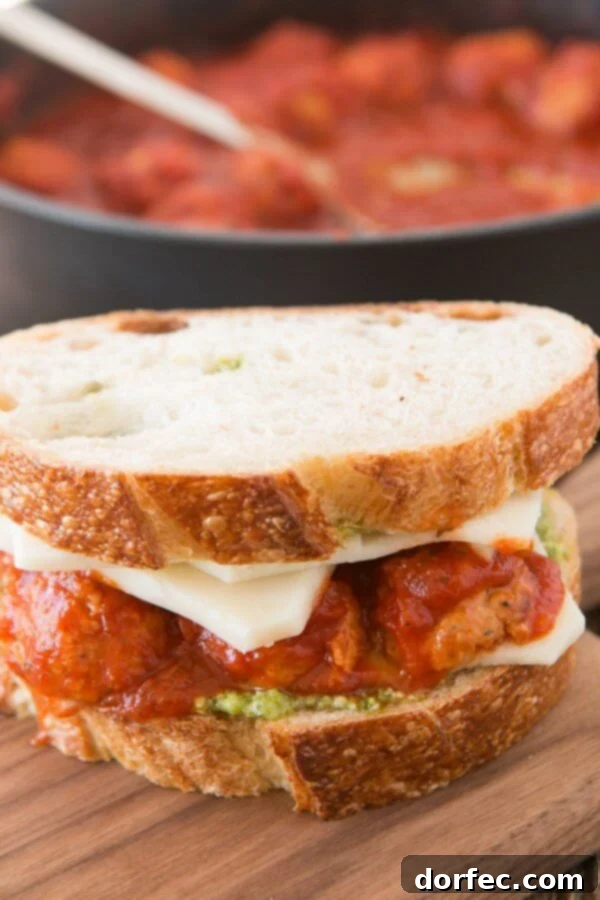 Saucy Johnsonville Meatballs for the Ultimate Pesto Panini Johnsonville Italian Sausage Meatballs simmering in marinara sauce, ready for a delicious Pesto Meatball Panini. A perfect easy dinner solution.