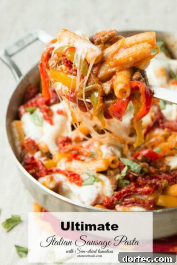 The Ultimate Pasta Recipe! Loaded pasta with caramelized onions, peppers, sausage, pepperoni and juicy sun-dried tomatoes ohsweetbasil.com