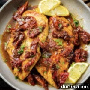A perfectly seared Greek citrus chicken breast, ready to serve.