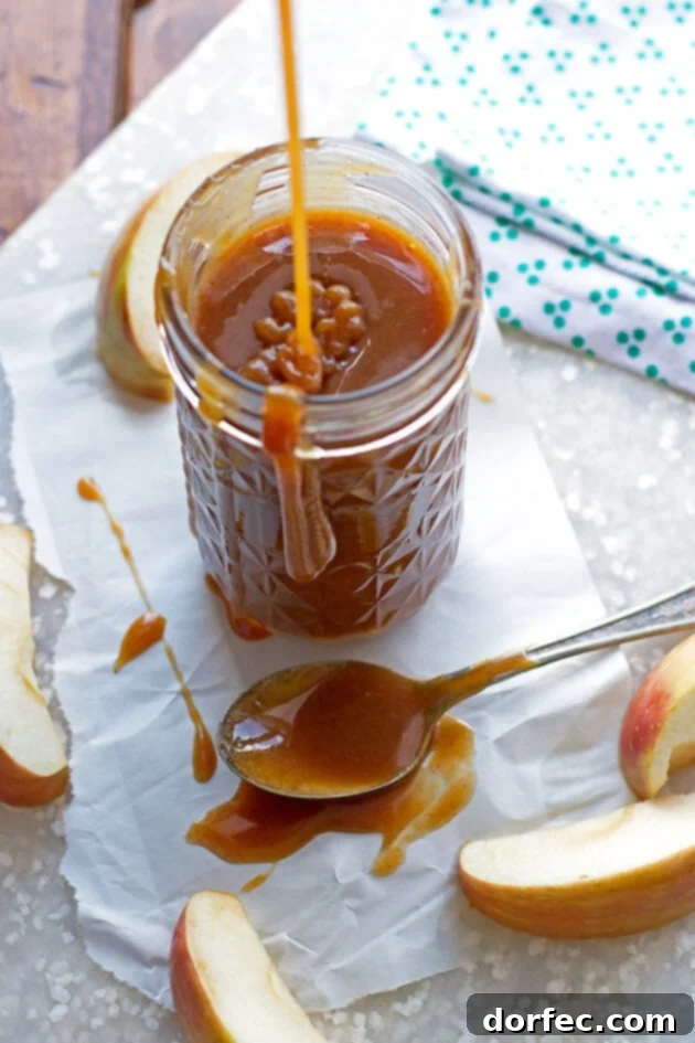 Instant Caramels: 6-Minute Microwave Magic 5 Delicious homemade apple cider caramel sauce in a glass jar, perfect for drizzling over desserts.