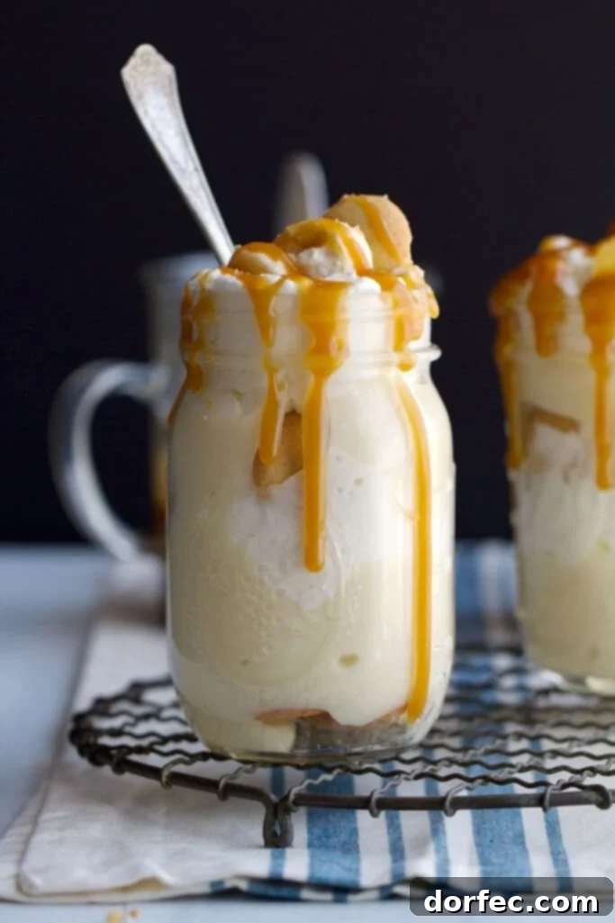 Instant Caramels: 6-Minute Microwave Magic 6 Creamy banana pudding with a generous drizzle of salted caramel sauce and a garnish of fresh bananas.