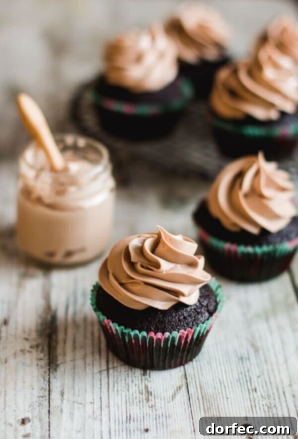 Moist and super chocolatey milk chocolate cupcakes topped with a perfectly smooth milk chocolate frosting that tastes incredible.