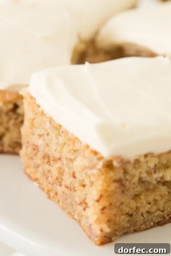 Rich and flavorful banana cake with smooth cream cheese frosting, a true dessert masterpiece.