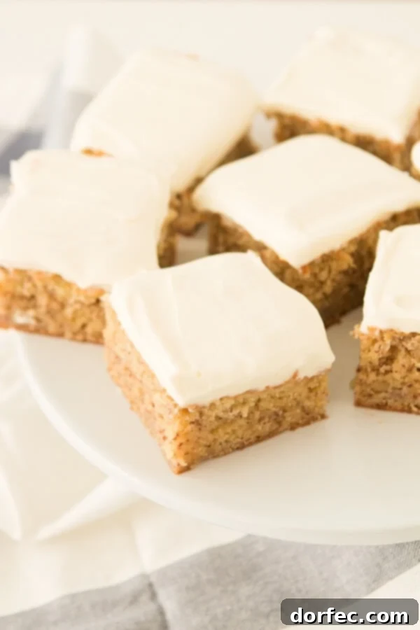 Close-up of fluffy banana cake interior, showing its perfectly moist crumb and rich banana flavor.