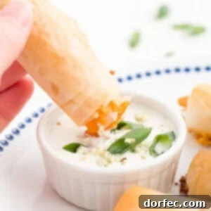 Crispy Buffalo Chicken Phyllo Bites 2 A top-down view of the ingredients for Buffalo Chicken Phyllo Rolls and Blue Cheese Dressing laid out on a clean counter.
