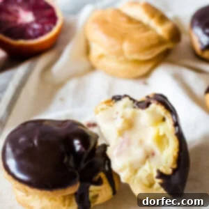 Cute little puffs are filled with sweet, blood orange cream and topped with a simple chocolate ganache to make these irresistible blood orange and chocolate cream puffs.