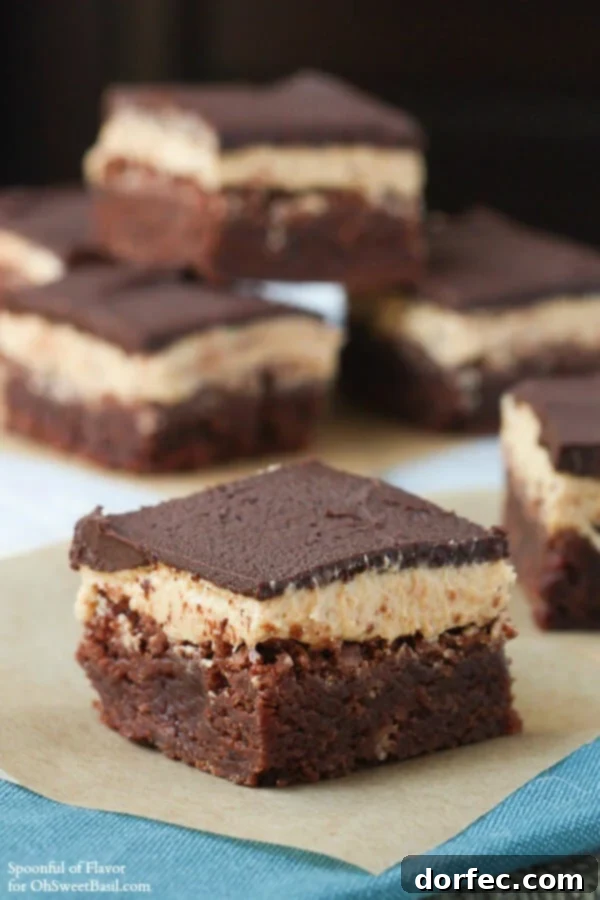 Irresistible Chocolate Peanut Butter Triple Layer Brownies, a rich and fudgy dessert for chocolate and peanut butter lovers. #dessert