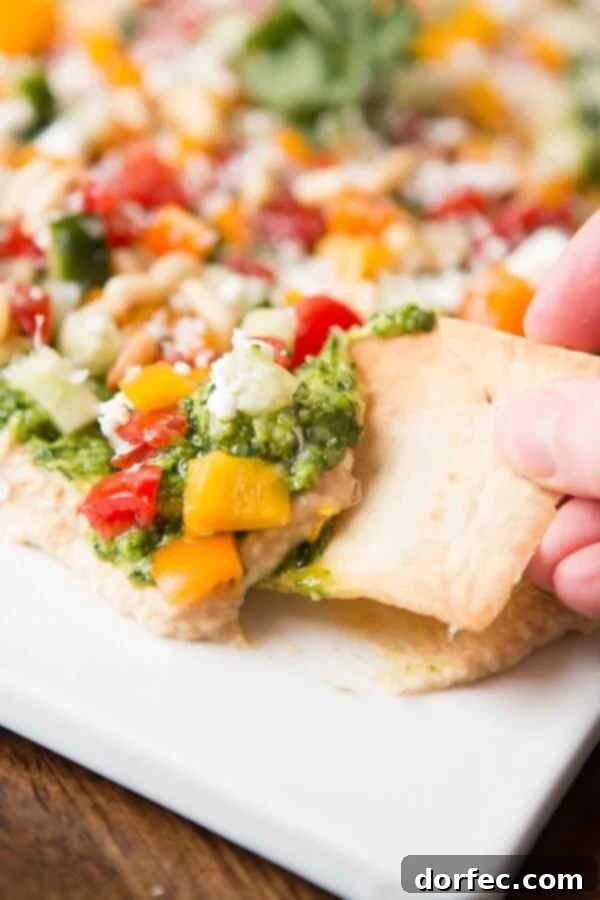 Toasted pine nuts adding a rich, nutty flavor to the 8 layer hummus dip
