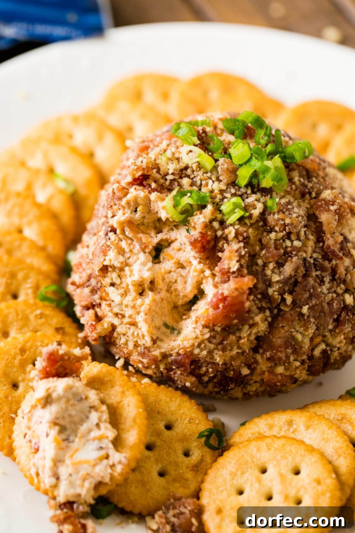Best cheese ball recipe for parties, featuring BBQ, bacon, cheese, and a pecan coating