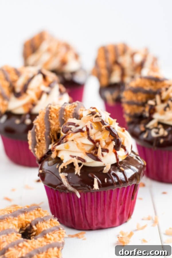 Decadent Samoa Cupcakes featuring rich chocolate, gooey caramel, and toasted coconut, inspired by classic Girl Scout cookies.