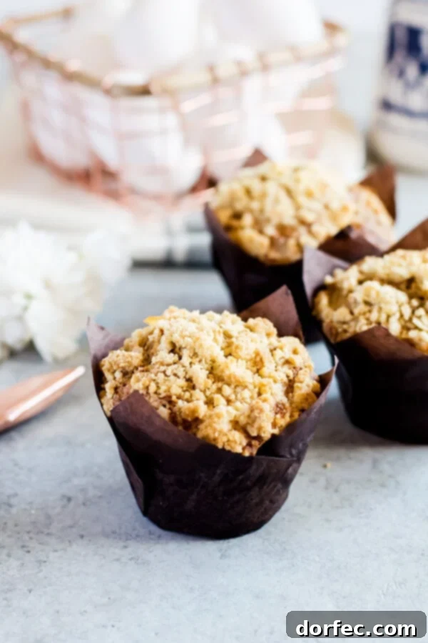 Freshly Baked Carrot Cake Muffins for Breakfast Freshly baked carrot cake muffins with a perfect crumb topping, ready to enjoy.