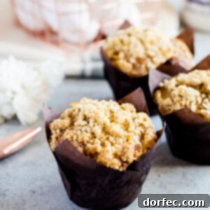 Spiced Carrot Muffins with Streusel 2 A freshly baked carrot cake muffin with crumb topping.