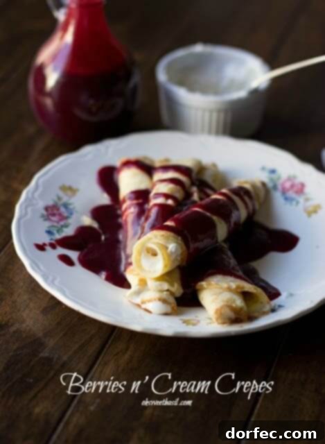 Cream-filled crepes with strawberry syrup Delicious cream-filled crepes topped with a vibrant Marionberry Strawberry Syrup, perfect for a decadent breakfast.