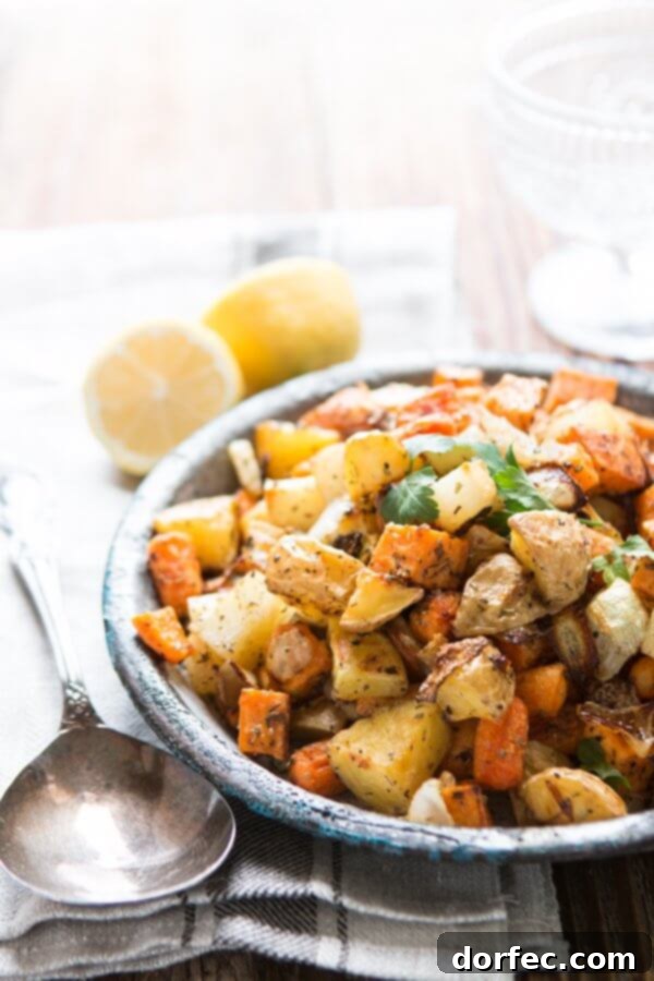One of our favorite side dishes can also be made into a simple main dish! Roasted root vegetable side dish with simple herbs! Whole 30, paleo, gluten-free, dairy-free roasted root vegetable side dish in serving bowl